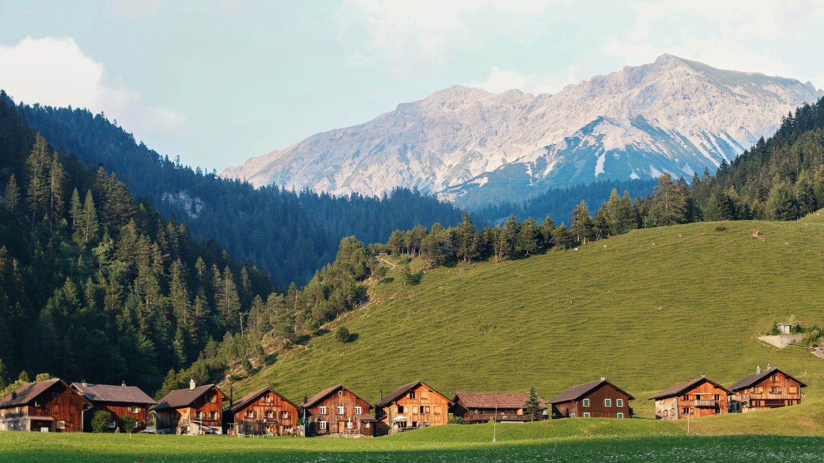 houses surrounded by mountains