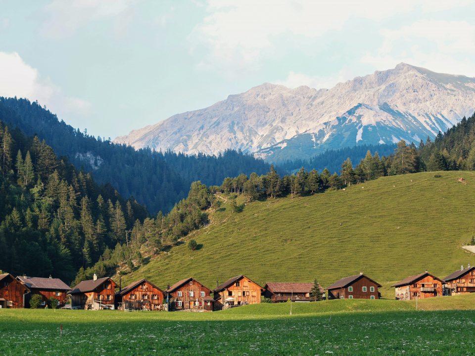 houses surrounded by mountains